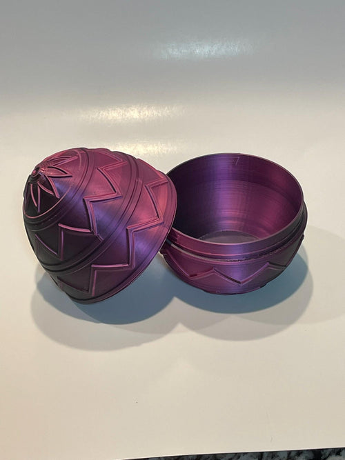 Purple metallic egg-shaped container.